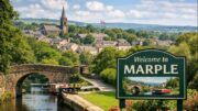 View of Marple in Greater Manchester with canal, stone bridge and town centre