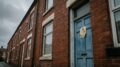 Housing inspection notice on terraced house door