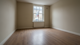 Empty rental property interior with To Let sign visible through window