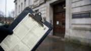 Council clipboard with duplicate penalty notices outside town hall