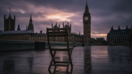 Westminster Palace at dusk with empty chair symbolising government silence