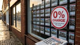 Estate agent window showing flat house prices