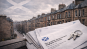Scottish tenement buildings on an overcast day, with a subtle Saltire flag in the sky and government correspondence letters in the foreground, suggesting housing policy in Scotland.