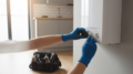 Engineer hands adjusting combi boiler in rental property