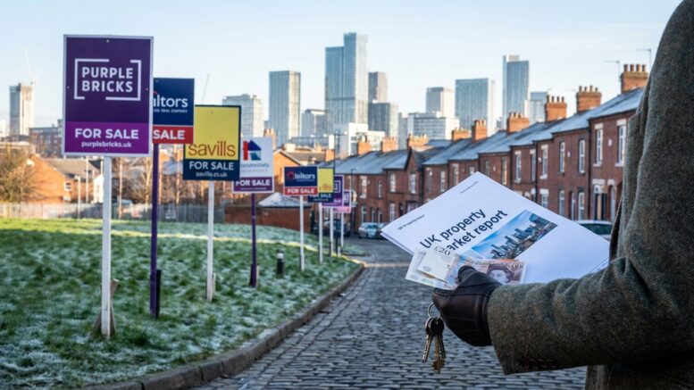 Manchester skyline with For Sale signs in foreground