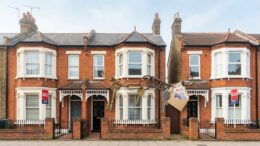 Sold signs connect terraced houses in property chain