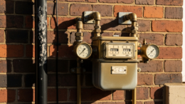 Gas meter on British terraced house exterior