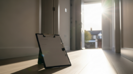 Property inspection clipboard in UK rental home hallway