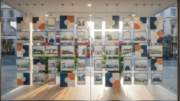 Estate agent window display with property listings
