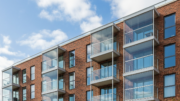 Modern apartment building with balconies representing shared ownership