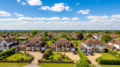 Aerial view of British suburban homes showing housing wealth