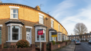 Property with sold sign representing bridging finance