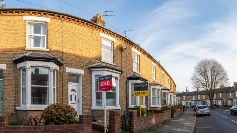 Property with sold sign representing bridging finance