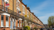 Terraced houses with SOLD signs on British street