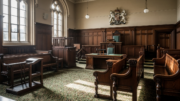 Empty British county courtroom with wooden benches