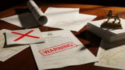 Reference documents with warning marks suggesting fraud risk