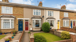 Terraced houses on a British street with small gardens