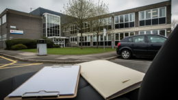 British council office exterior with housing compliance clipboard