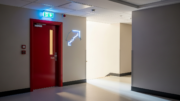 Modern apartment block corridor with fire door