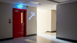 Modern apartment block corridor with fire door