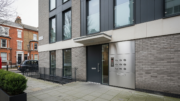 London flat entrance with doorbells and closed front door