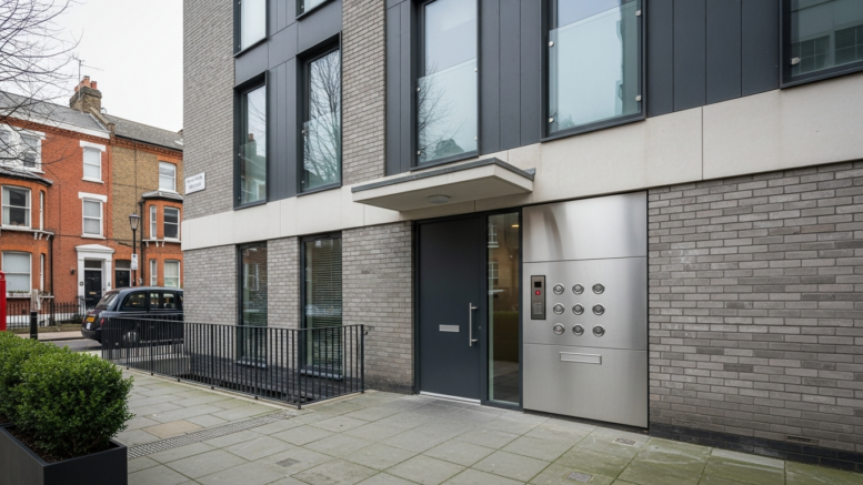 London flat entrance with doorbells and closed front door