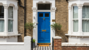 Blue front door on British terraced rental house