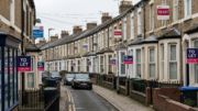UK rental street with To Let boards and housing supply pressure