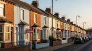 British terraced houses on residential street with rental signs