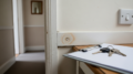 Realistic UK rental property damp and maintenance inspection scene