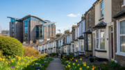 Welsh terraced homes with civic building in daylight