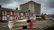 Council enforcement files with UK rental housing backdrop