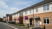Modern British terraced houses on a bright rental street