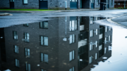 Modern UK flats on a street after rain