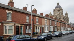 Liverpool terraced homes with civic skyline