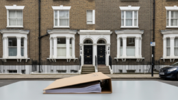 British townhouse with legal file in foreground
