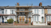 Vacant British house with scaffolding in daylight