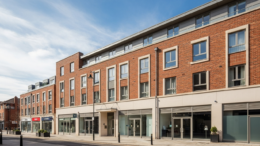 British flats above shops on a bright high street