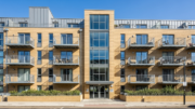 Modern British flat block with balconies in daylight