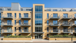 Modern British flat block with balconies in daylight