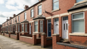 Red brick rental terraces on a Merseyside street