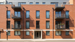 Modern apartment block on a bright British street