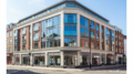 Mixed-use high street building with flats above shops