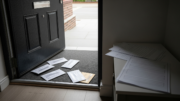 Rental flat entrance with unopened letters