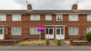 British flat with clear For Sale board and empty entrance