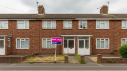 British flat with clear For Sale board and empty entrance