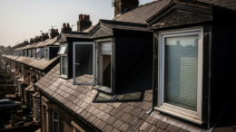 Dormer windows on rental roof in summer heat