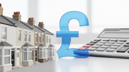 Row of UK terraced houses with pound symbol