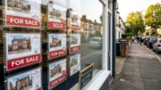 UK For Sale boards on a suburban street