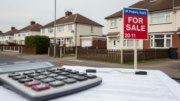 UK homes with For Sale board and finance paperwork